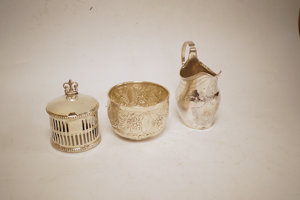 A George III silver helmet shaped cream jug, marks rubbed, 10cm(a.f.), together with a later Victorian silver sugar bowl and similar pierced silver mustard pot, no liner.